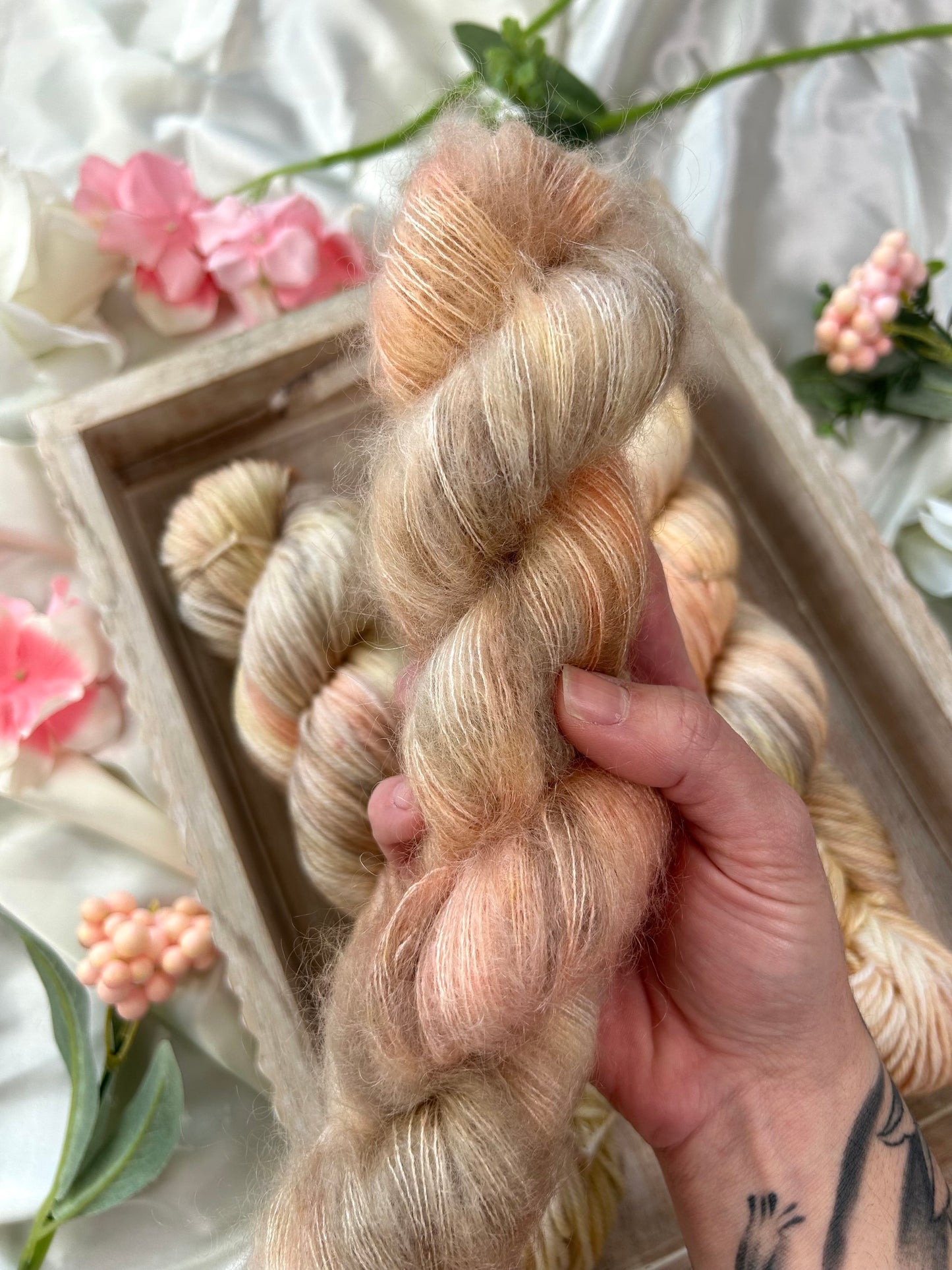 custom cream, salmon pink, light yellow variegated hand dyed yarn on superwash merino dk weight and silk mohair weight