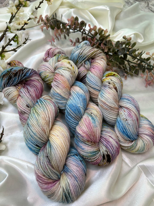 custom orchid pink, mauve, blue, cream variegated hand dyed with fawn brown speckles on superwash merino dk weight