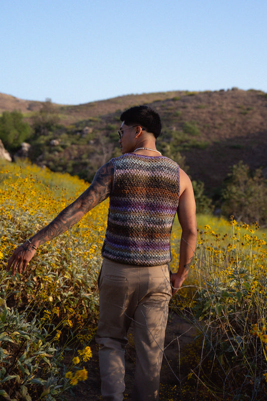 Jordan wearing a colorful crochet tank top with a textured mesh stitch.