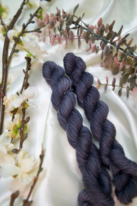 custom semisolid hand dyed yarn with deep grey on nylon superwash sock yarn