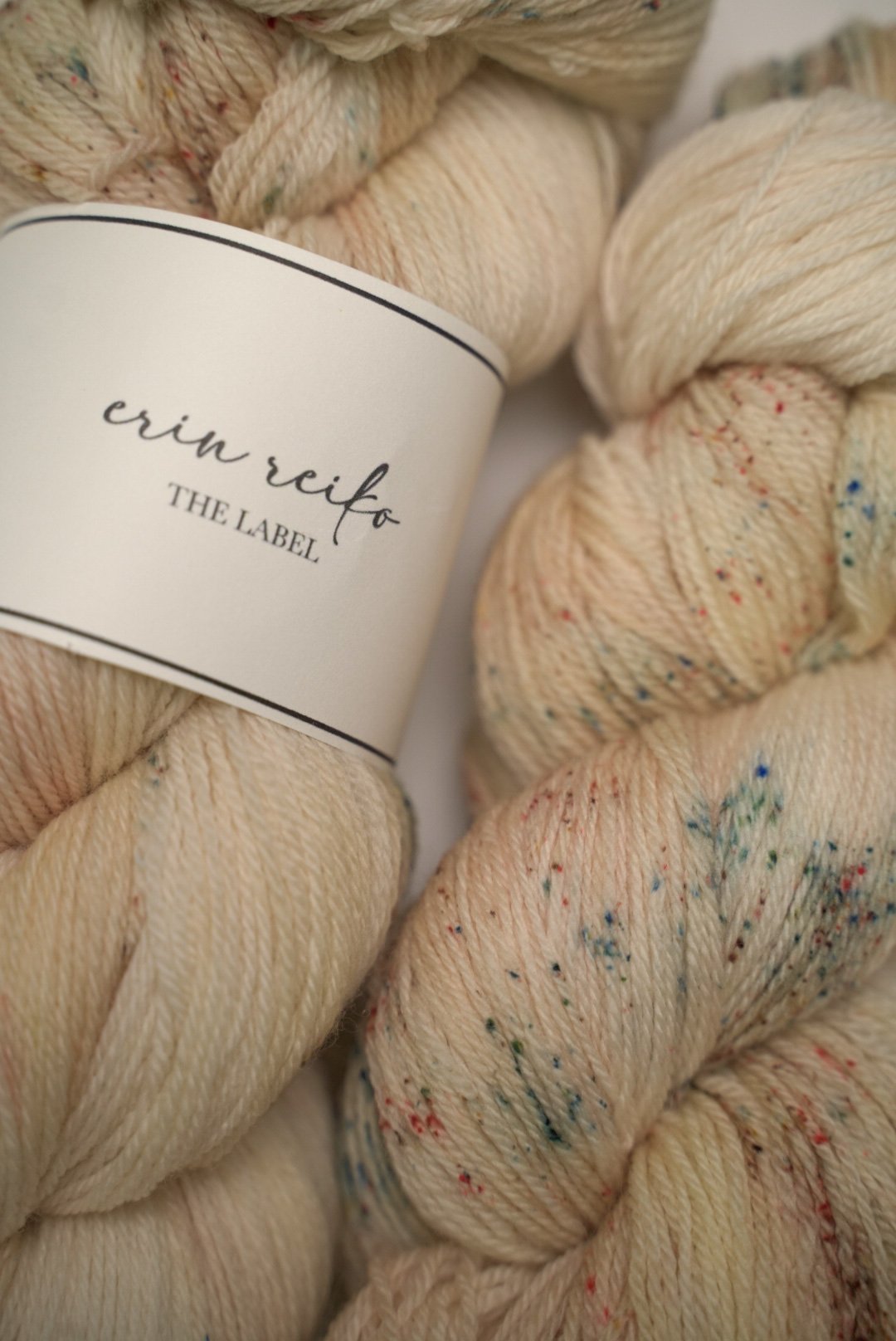custom variegated hand dyed yarn with soft browns and creamy gold with sage green and mocha brown speckles on superwash fingering weight yarn