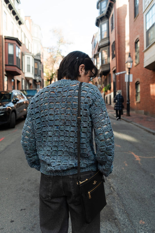 Unique vintage crochet sweater designed with eyelets and texture for unisex look