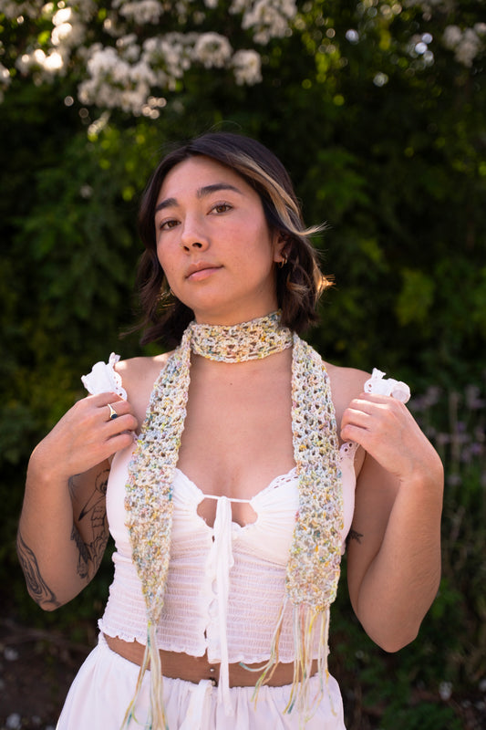 erin wearing a unique lace crochet accessory as a scarf, made with variegated hand dyed yarn