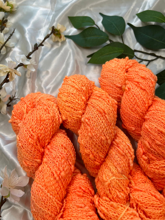 custom neon orange hand dyed yarn semi solid dyed on superwash slub fiber