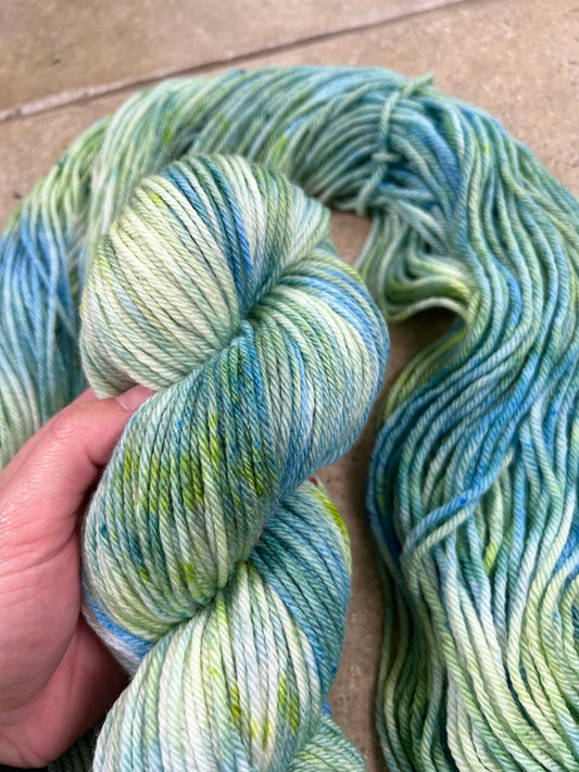 custom ocean blue, lime green and seafoam green variegated hand dyed yarn on superwash merino dk weight