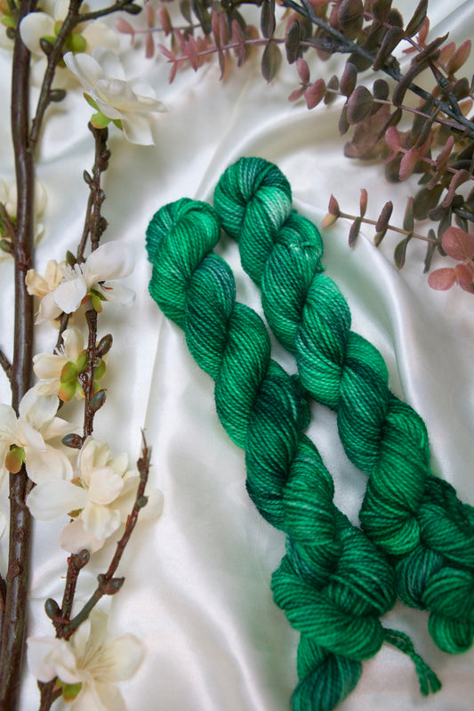 custom grass green and dark green semisolid hand dyed yarn on nylon superwash sock yarn