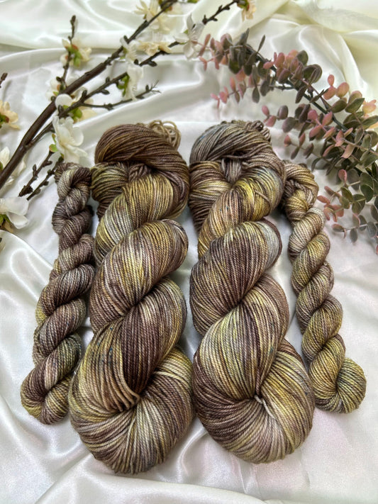 custom brown, grey, cocoa and gold variegated hand dyed yarn on nylon superwash merino fingering weight