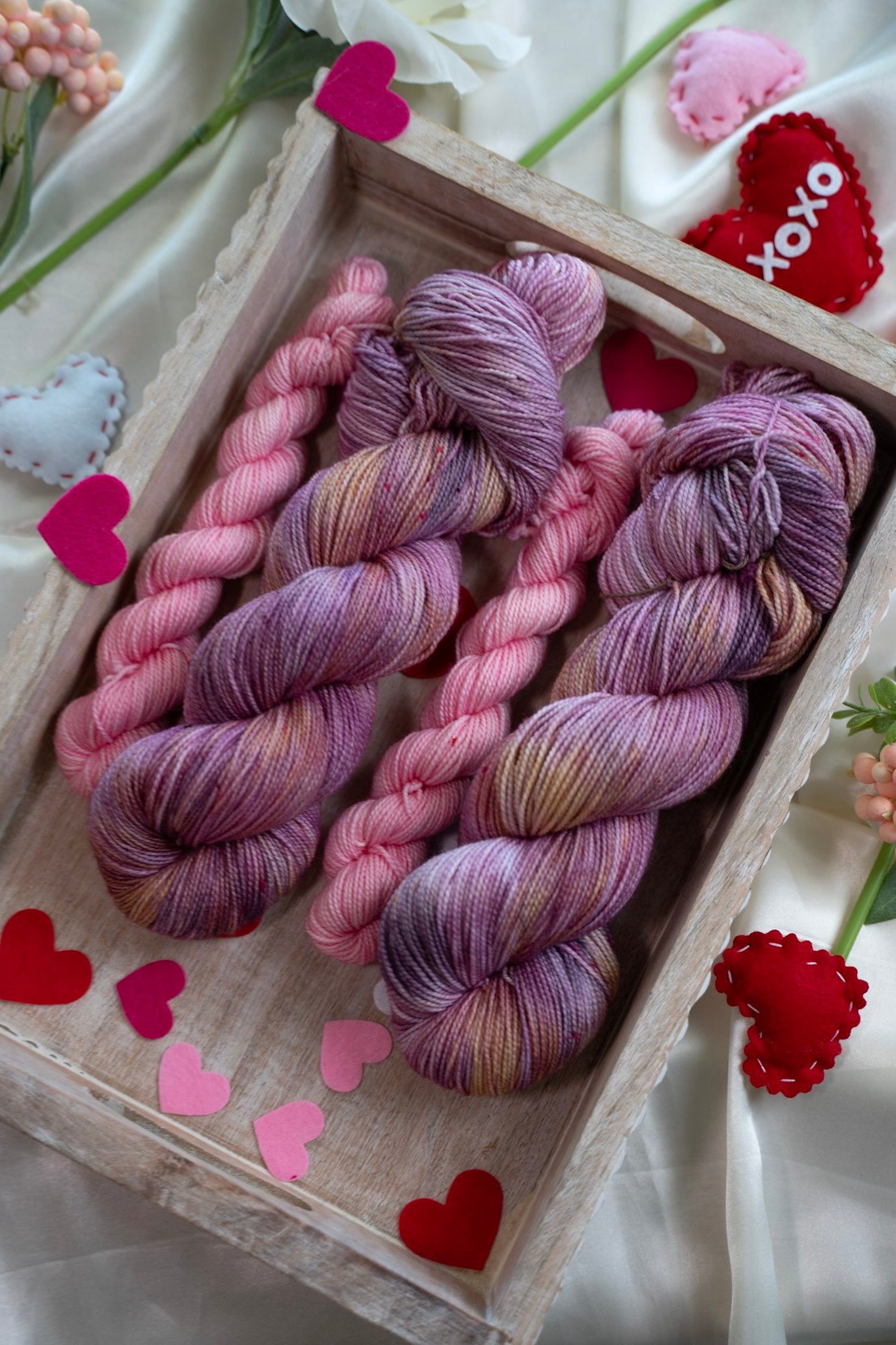 custom purple, mauve and pink variegated hand dyed yarn with gold and bright pink speckles on nylon superwash sock weight