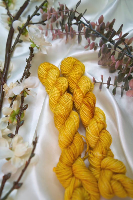 custom golden yellow semisolid hand dyed yarn on nylon superwash sock yarn