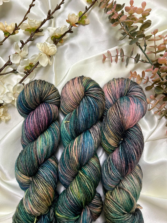 custom black, neon pink, teal, green blue variegated hand dyed yarn on nylon superwash merino dk weight