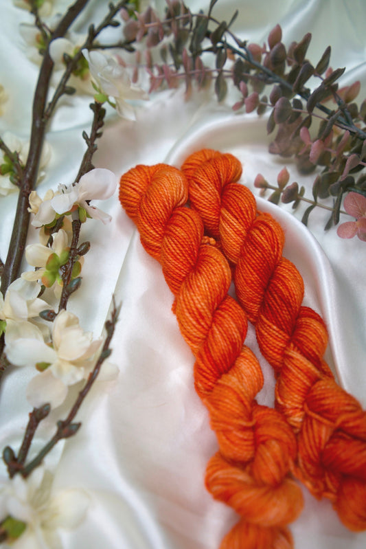 custom saffron orange semisolid hand dyed yarn on nylon superwash merino sock yarn