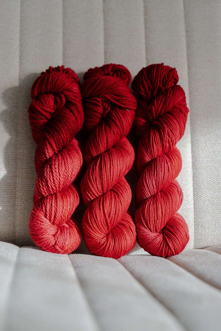 custom medium toned cherry red semisolid hand dyed yarn on nylon superwash sock yarn