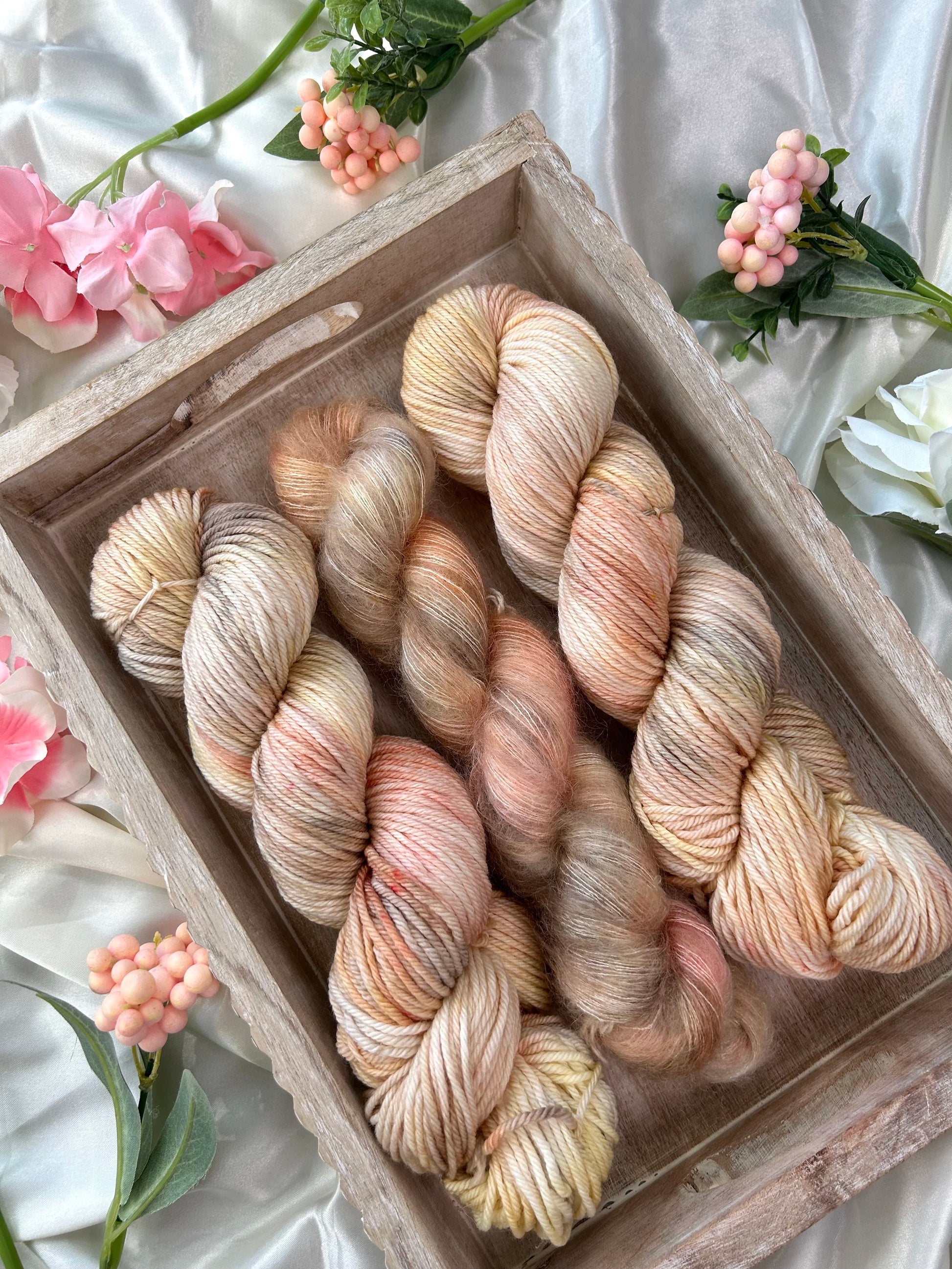 custom cream, salmon pink, light yellow variegated hand dyed yarn on superwash merino dk weight and silk mohair weight 