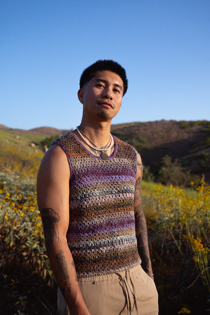 Jordan wearing a colorful crochet tank top with a textured mesh stitch.