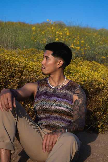 Jordan wearing a colorful crochet tank top with a textured mesh stitch.