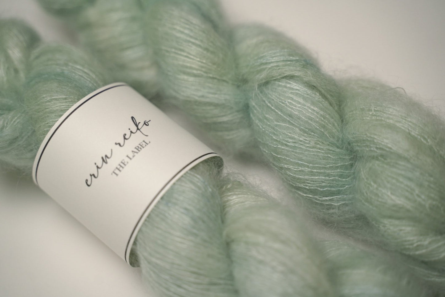 custom semisolid hand dyed yarn with pastel mint green and jade green on kid silk mohair yarn lace weight