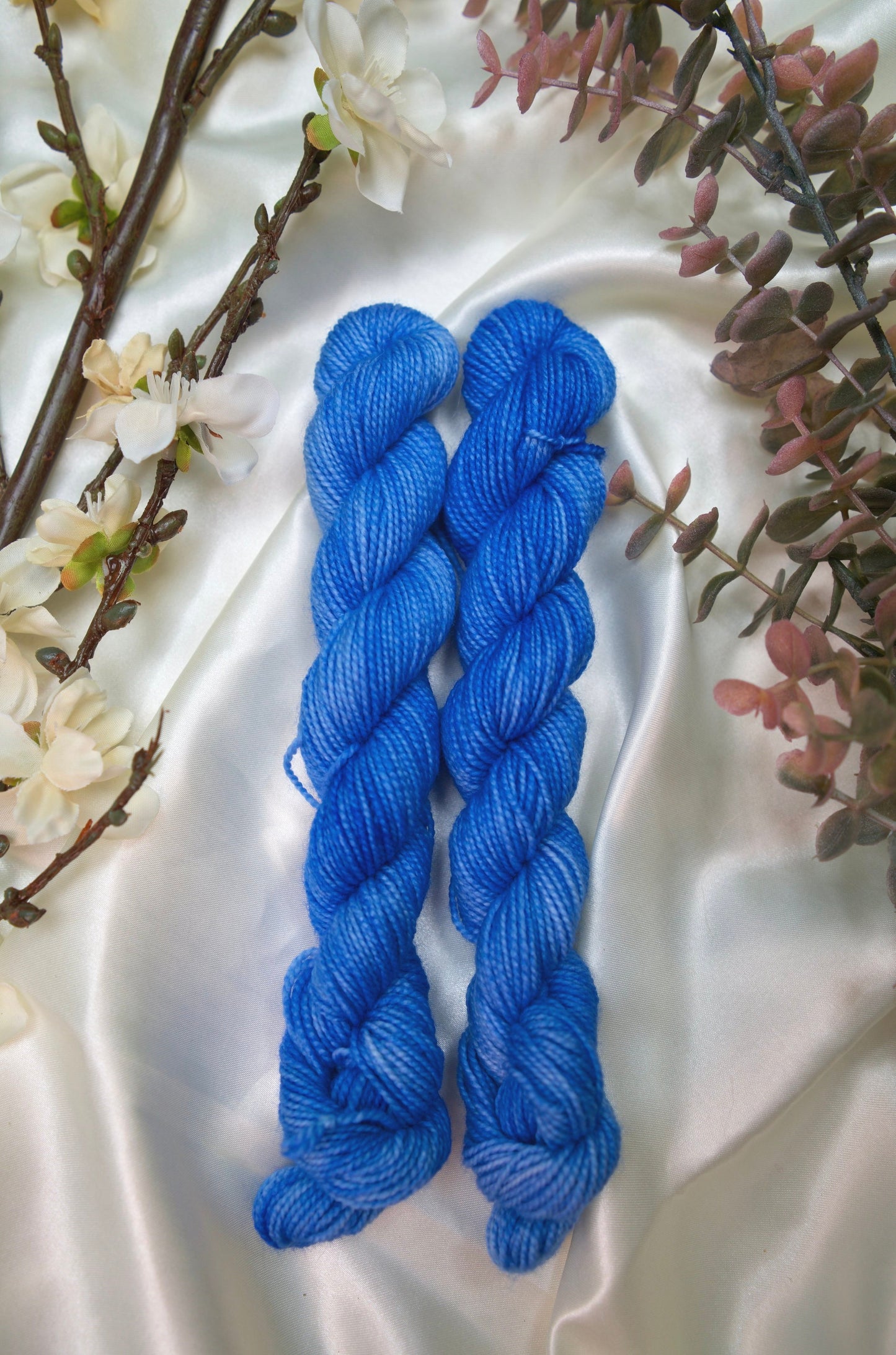 custom semisolid hand dyed yarn with bright sky blue and cornflower blue on nylon superwash sock yarn