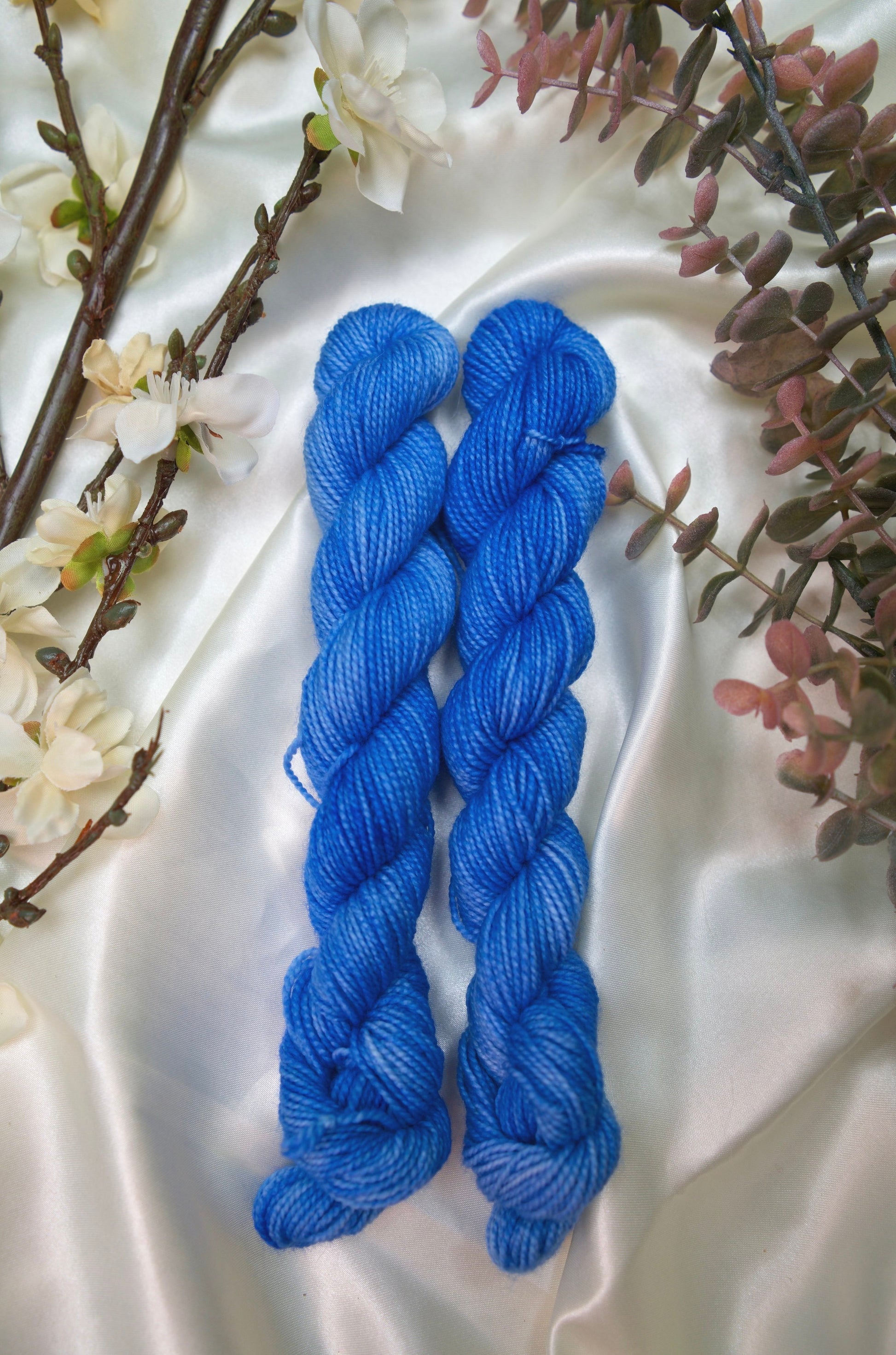 custom semisolid hand dyed yarn with bright sky blue and cornflower blue on nylon superwash sock yarn