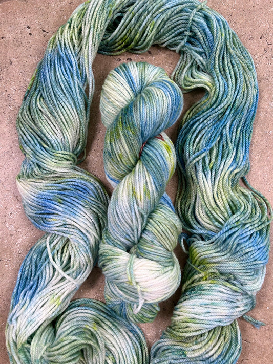 custom ocean blue, lime green and seafoam green variegated hand dyed yarn  on superwash merino dk weight