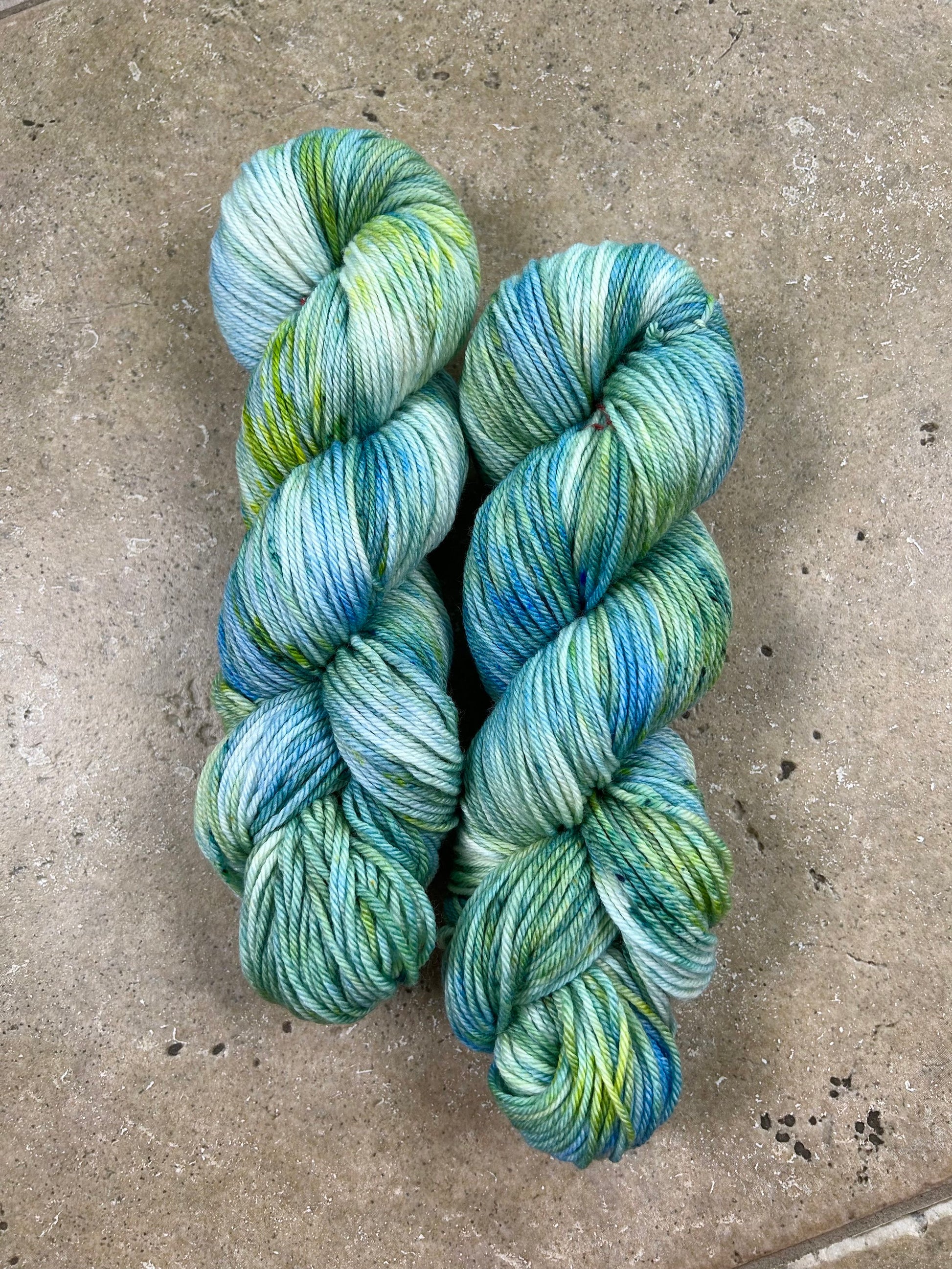 custom ocean blue, lime green and seafoam green variegated hand dyed yarn  on superwash merino dk weight