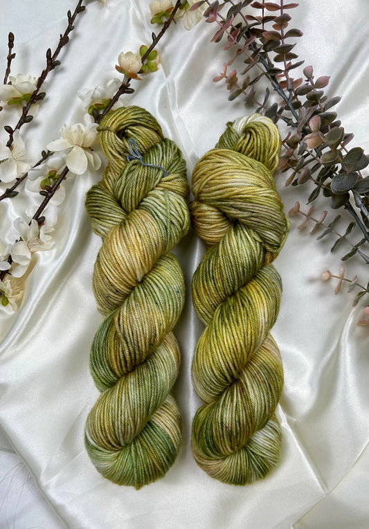 custom moss green, lichen, pastel gold, and sepia brown variegated hand dyed yarn on superwash merino dk weight 