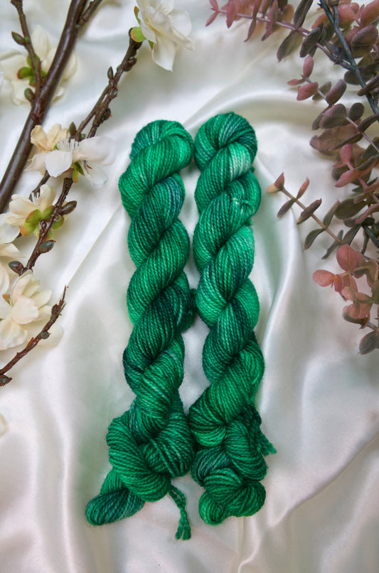 custom grass green and dark green semisolid hand dyed yarn on nylon superwash sock yarn