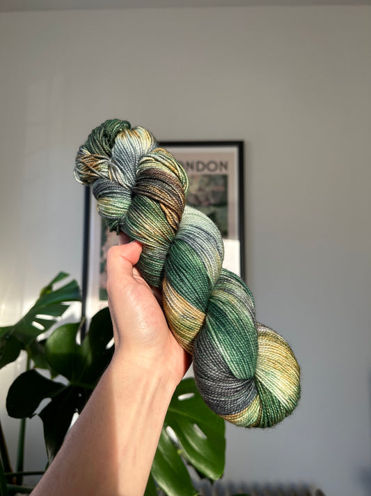 custom emerald green, forest green, gold, black, teal variegated hand dyed yarn on superwash nylon sock weight