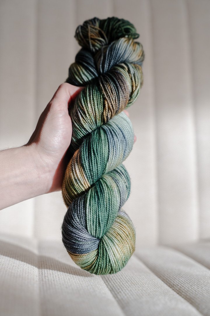 custom emerald green, forest green, gold, black, teal variegated hand dyed yarn on superwash nylon sock weight