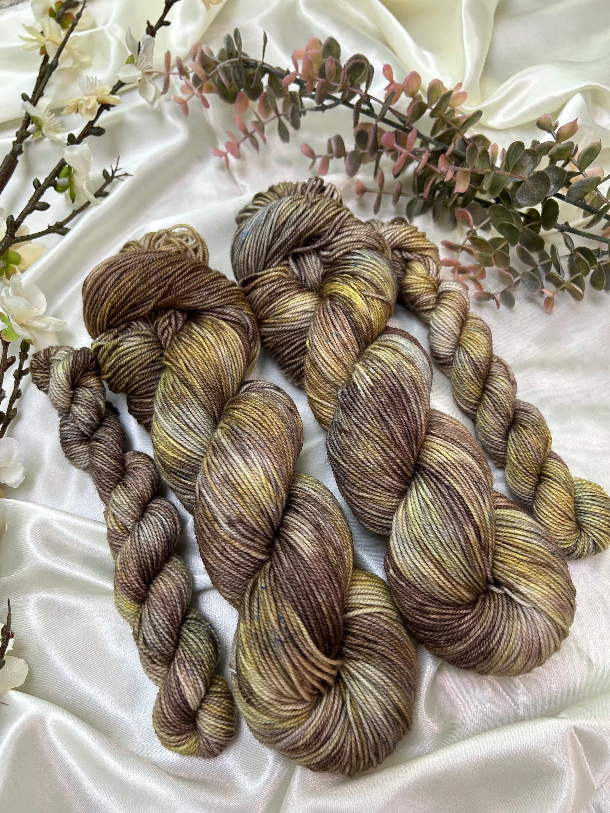 custom brown, grey, cocoa and gold variegated hand dyed yarn on nylon superwash merino fingering weight