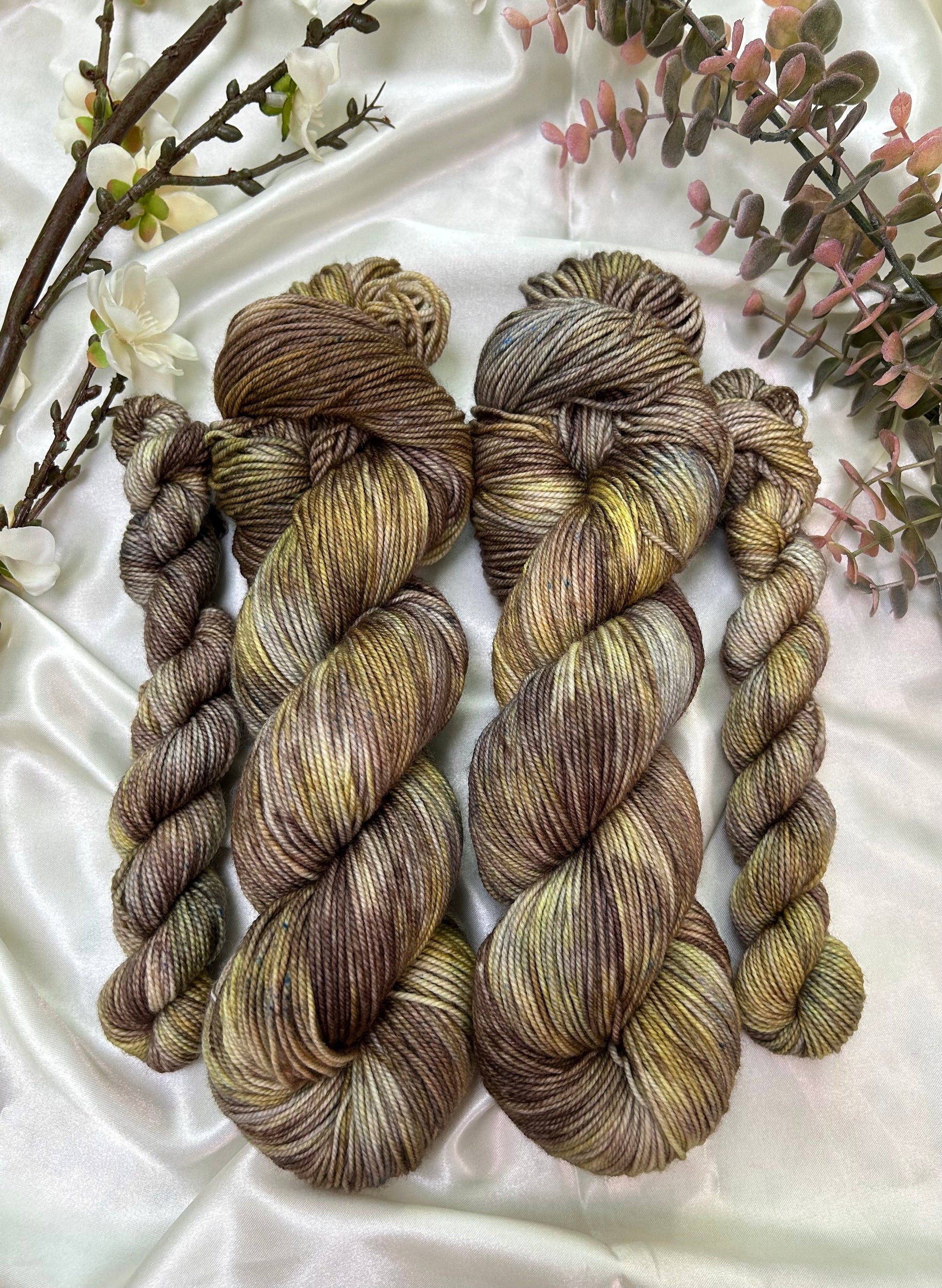 custom brown, grey, cocoa and gold variegated hand dyed yarn on nylon superwash merino fingering weight