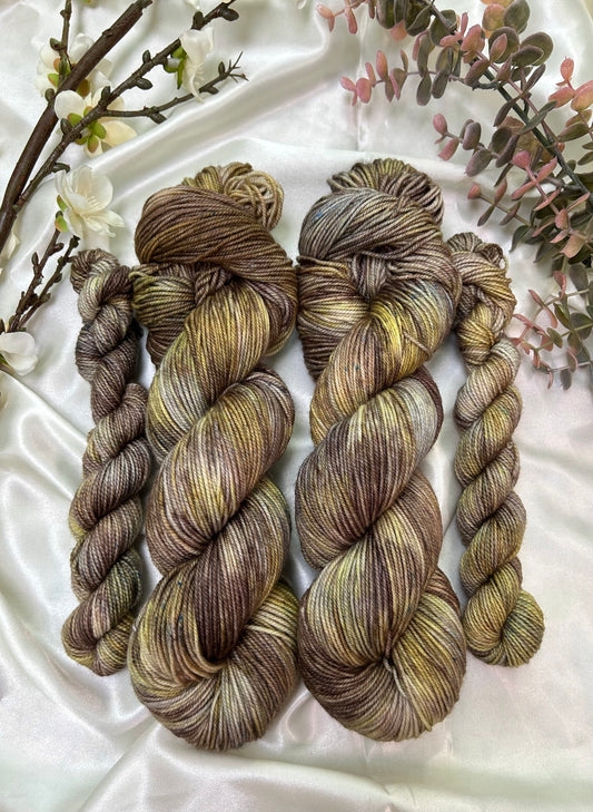 custom brown, grey, cocoa and gold variegated hand dyed yarn on nylon superwash merino fingering weight