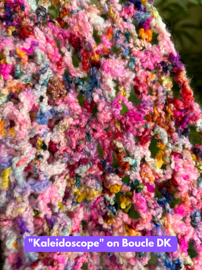 kaleidoscope hand dyed yarn crochet swatch on superwash merino boucle yarn