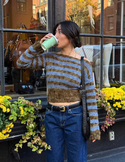 erin wearing striped long sleeve slouchy blouse in front of store window