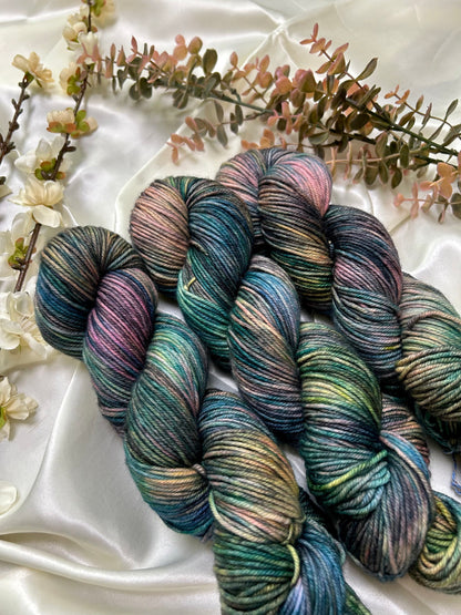 custom black, neon pink, teal, green blue variegated hand dyed yarn on nylon superwash merino dk weight
