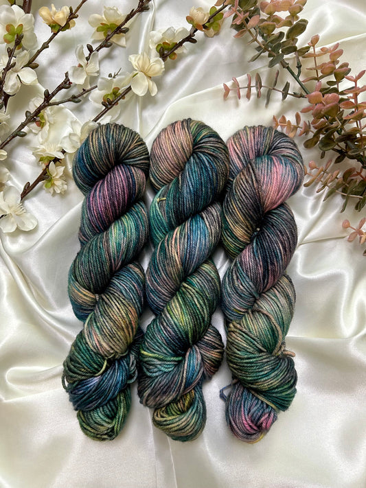 custom black, neon pink, teal, green blue variegated hand dyed yarn on nylon superwash merino dk weight