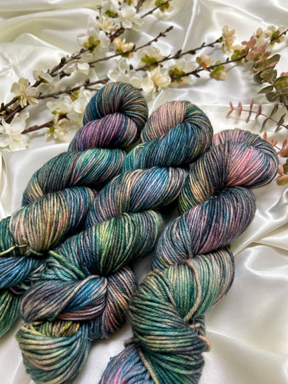 custom black, neon pink, teal, green blue variegated hand dyed yarn on nylon superwash merino dk weight
