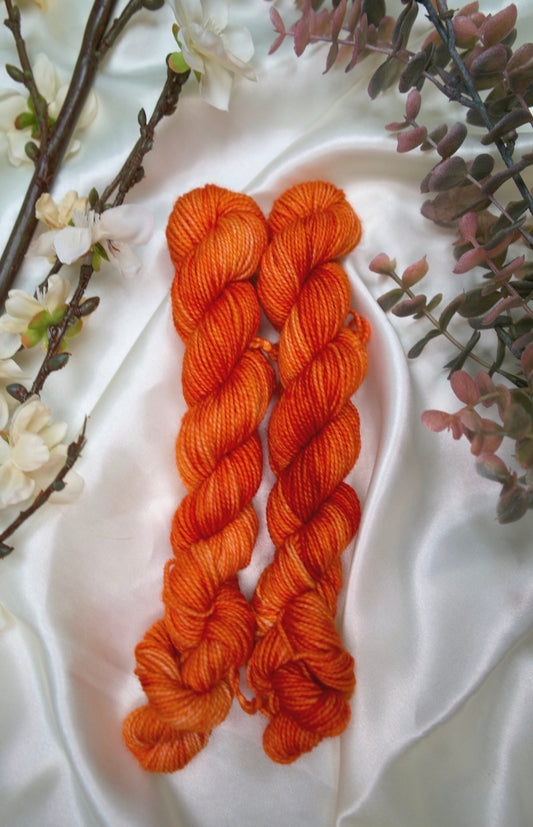 custom saffron orange semisolid hand dyed yarn on nylon superwash merino sock yarn