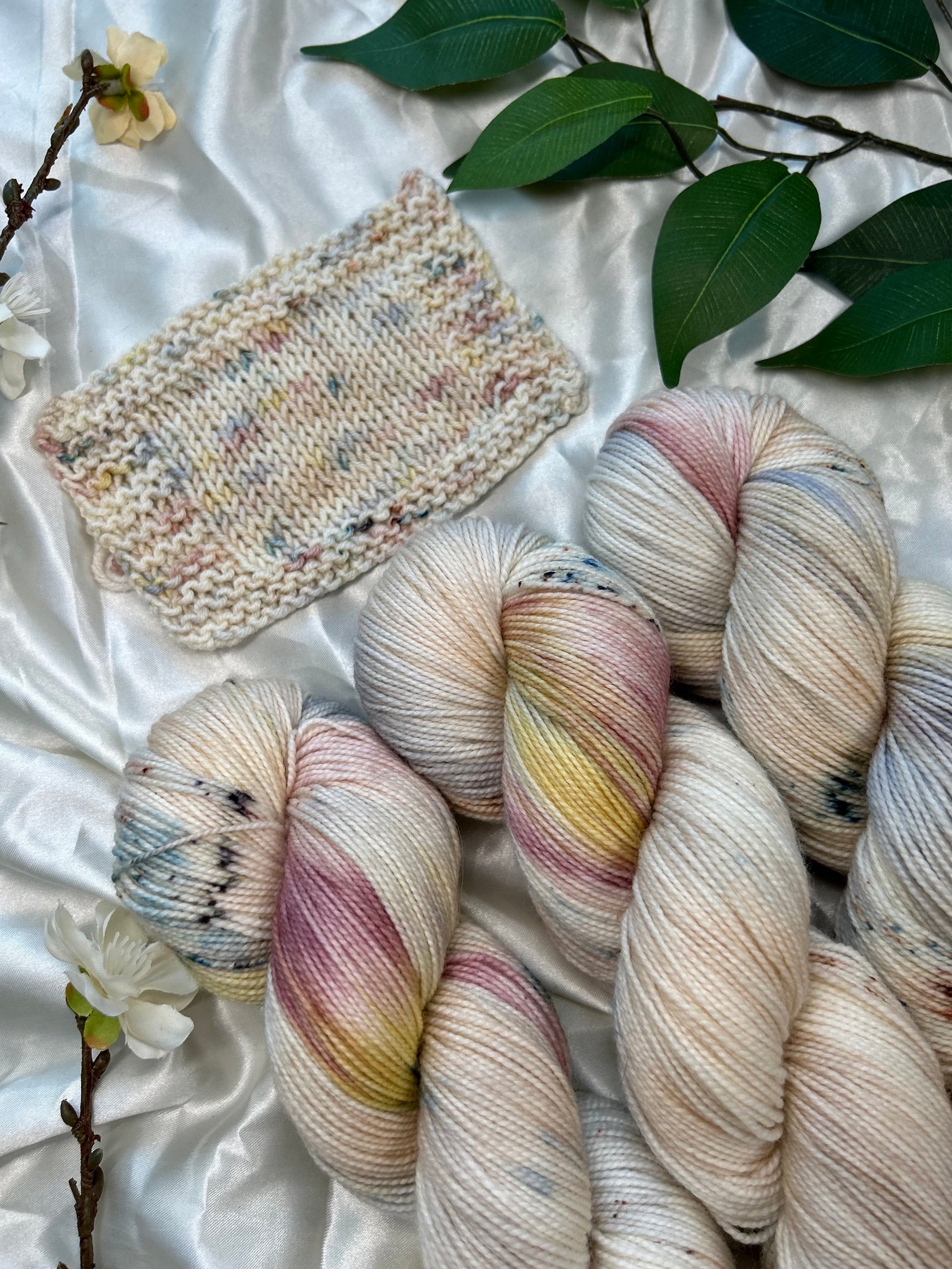 custom cream, tan, indigo, burgundy, gold variegated hand dyed yarn with tan speckles on nylon superwash sock weight