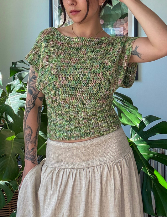 woman wearing crochet slouchy blouse with reiko fibers hand dyed yarn