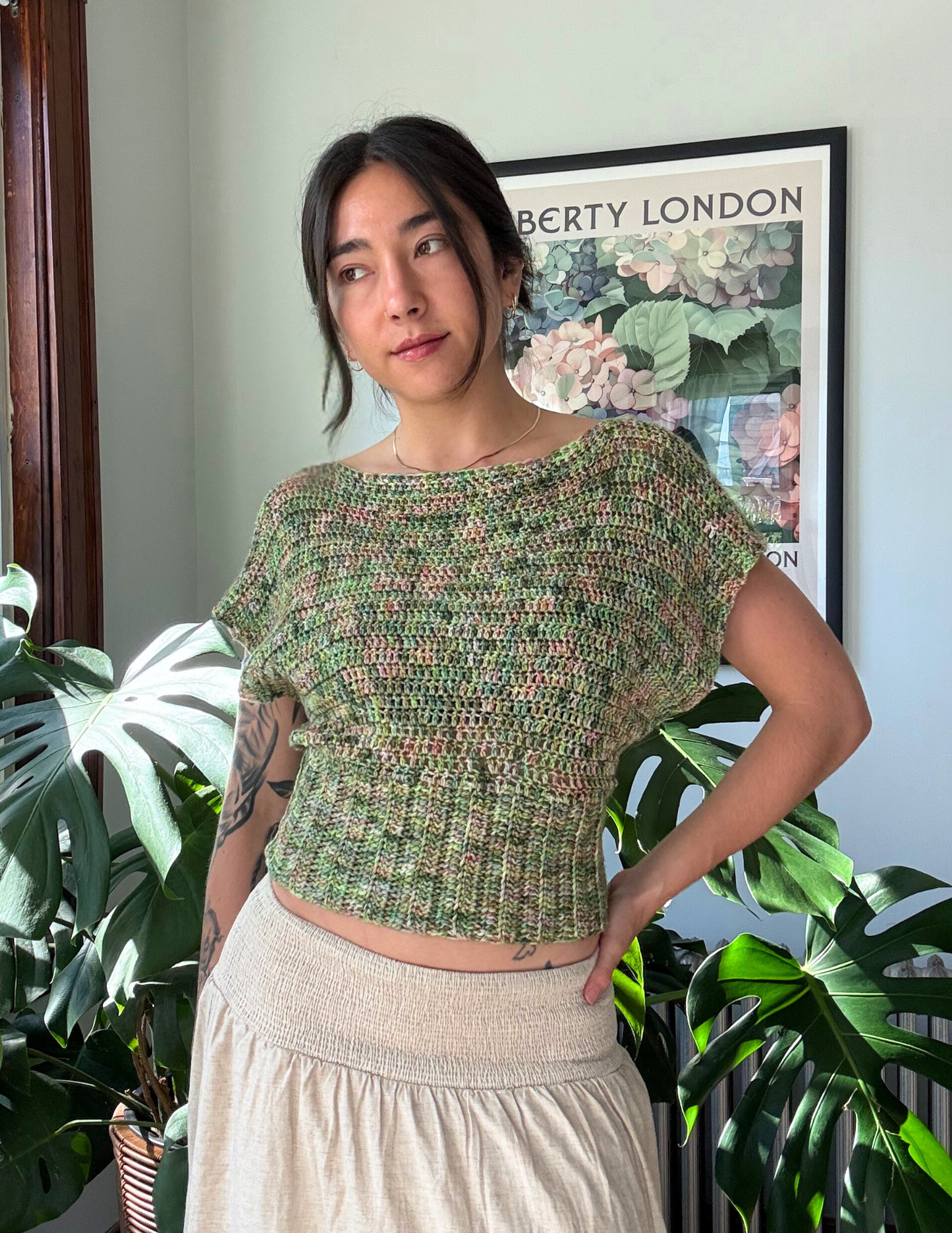 woman wearing crochet slouchy blouse with short sleeves and hand dyed yarn