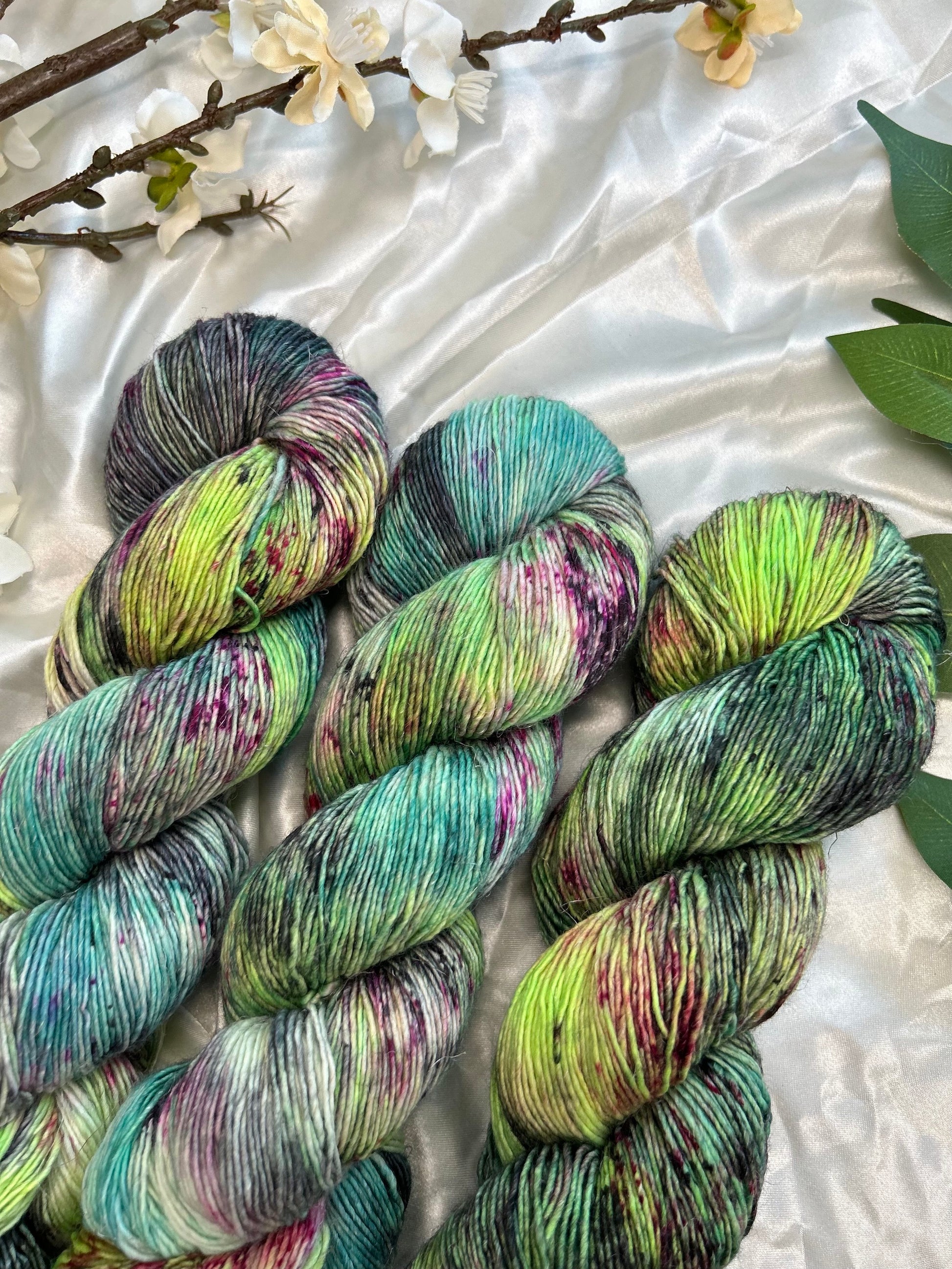 space cowboy colorway with neon blue, green, black, teal and cherry red speckles