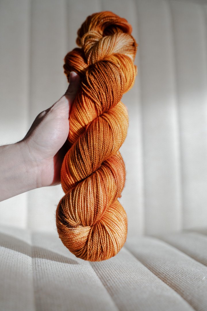 custom saffron, orange, cocoa brown, gold variegated hand dyed yarn on nylon superwash merino sock weight