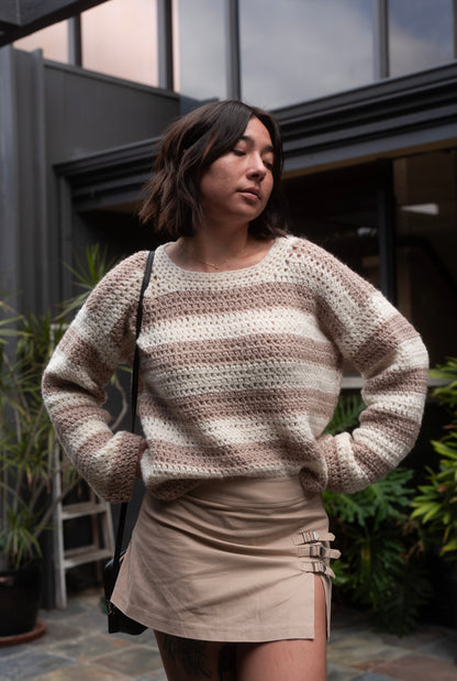 erin wearing a fluffy soft striped crochet sweater with crew neckline and tapered sleeves