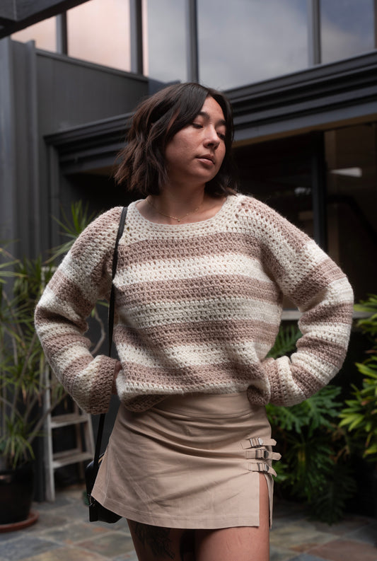 erin wearing a fluffy soft striped crochet sweater with crew neckline and tapered sleeves