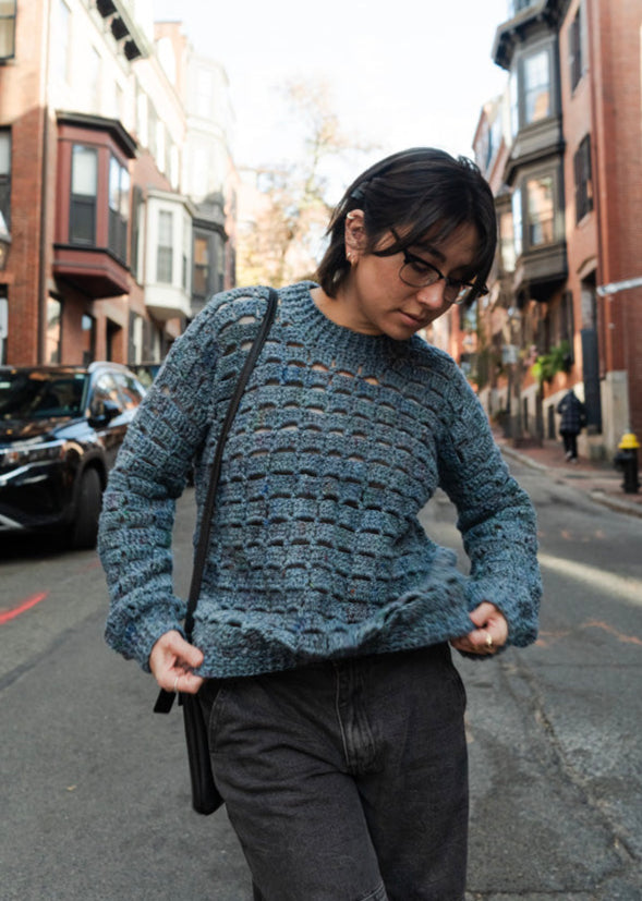 Unique vintage crochet sweater designed with eyelets and texture for unisex look