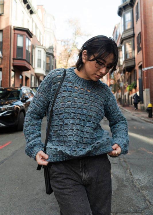 Unique vintage crochet sweater designed with eyelets and texture for unisex look