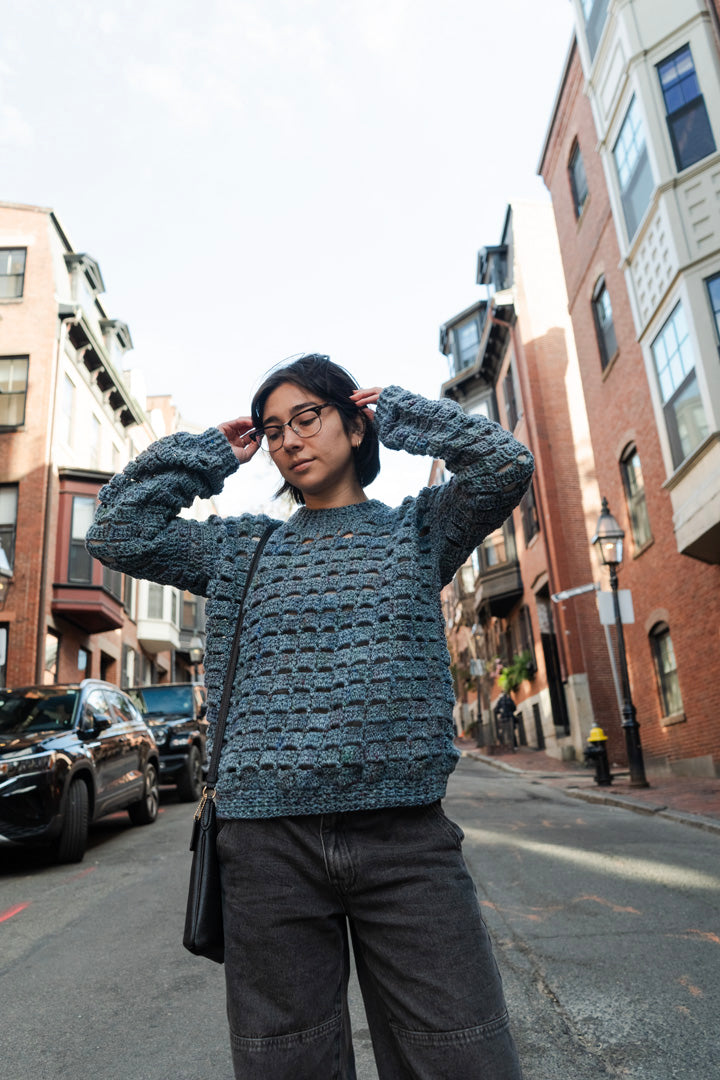 Unique vintage crochet sweater designed with eyelets and texture for unisex look