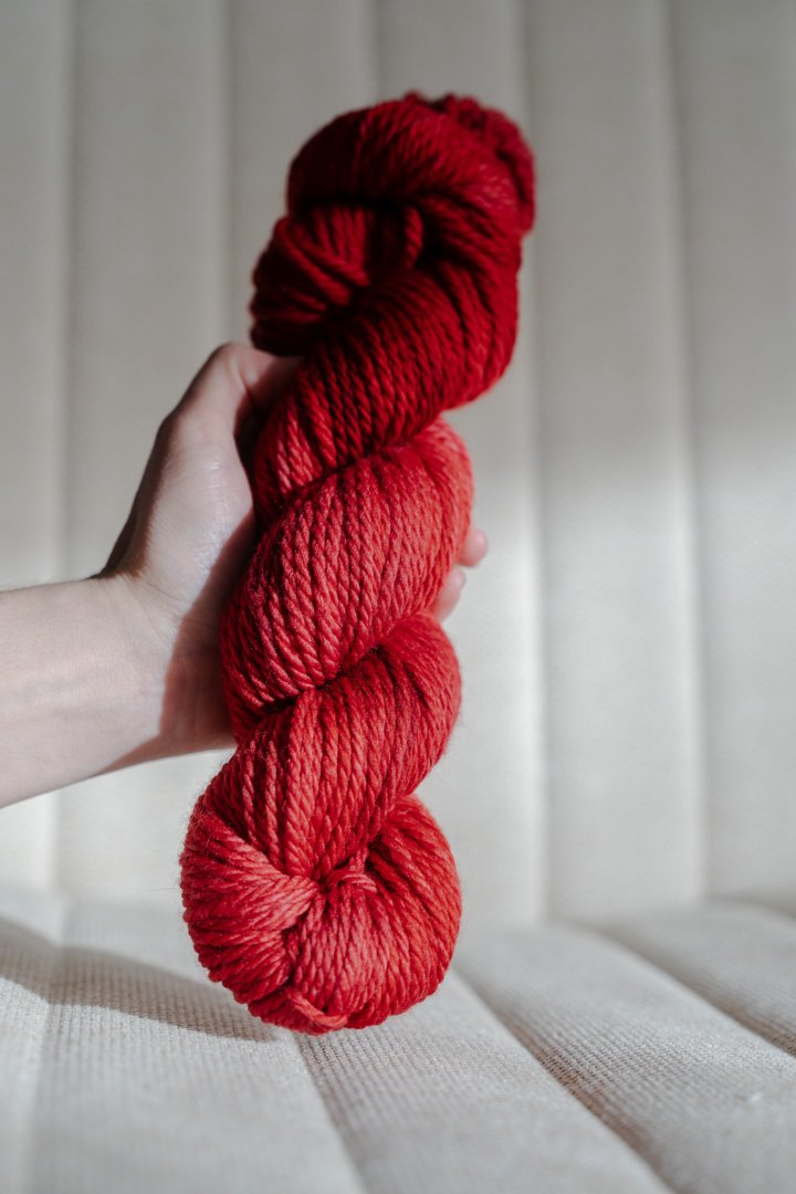 custom medium toned cherry red semisolid hand dyed yarn on superwash merino chunky yarn
