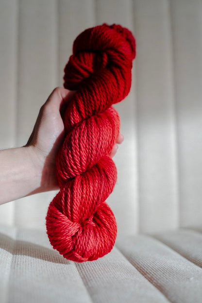 custom medium toned cherry red semisolid hand dyed yarn on superwash merino chunky yarn