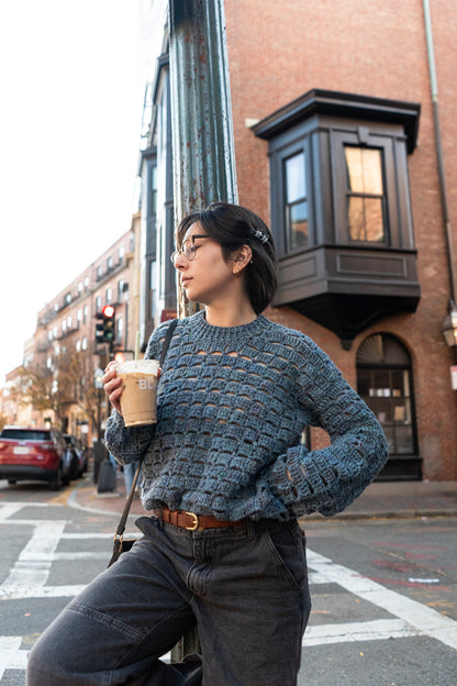 Unique vintage crochet sweater designed with eyelets and texture for unisex look